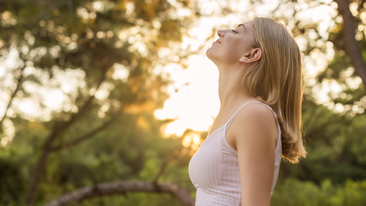 Woman breathing fresh air with ease.