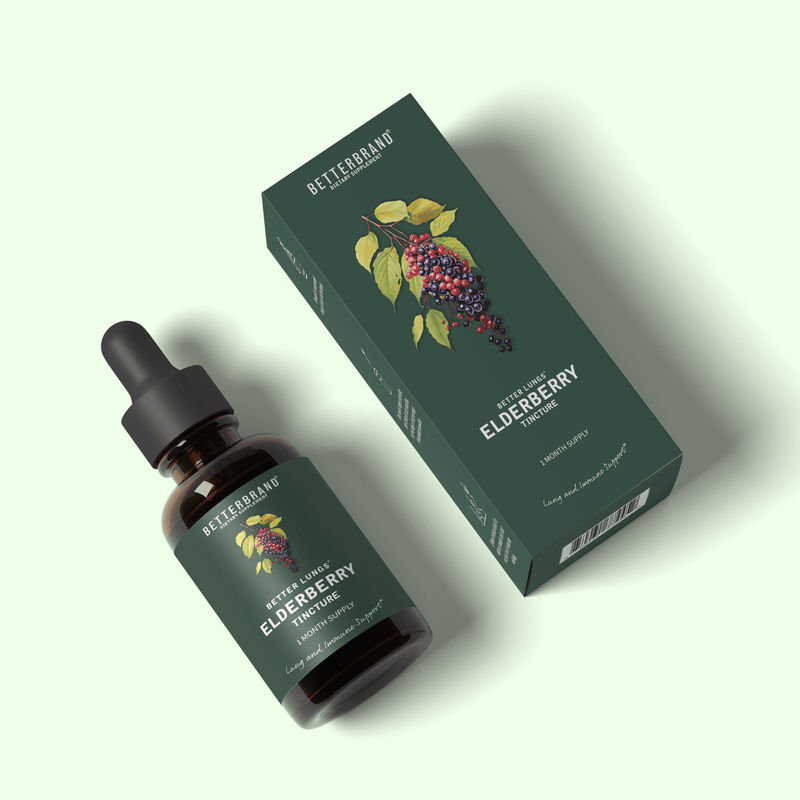 Bottle and box of BetterLungs Elderberry Tincture supplement with elderberry illustration on label and packaging