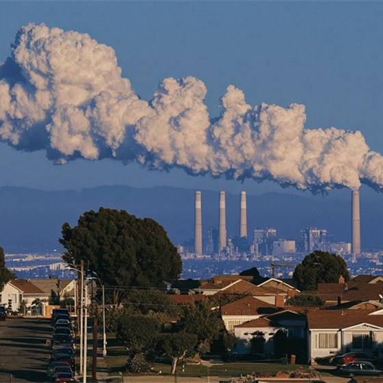 Industrial stacks venting above a residential street